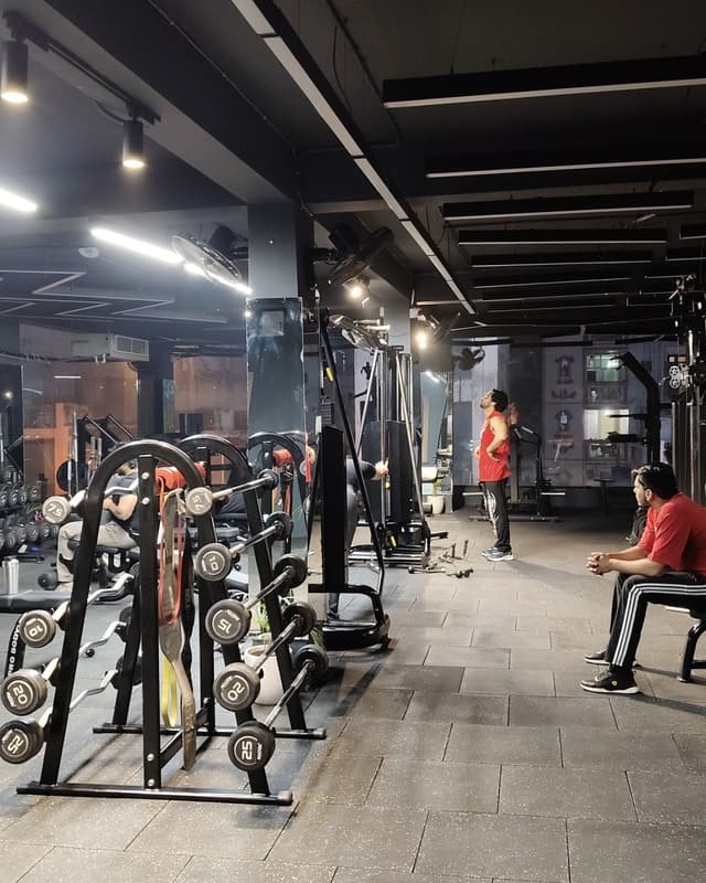 Dumbbell racks and cable machines on the strength floor